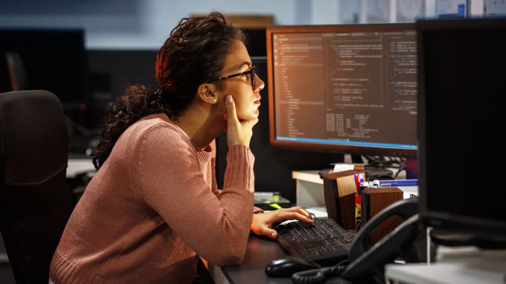 Woman writing code.