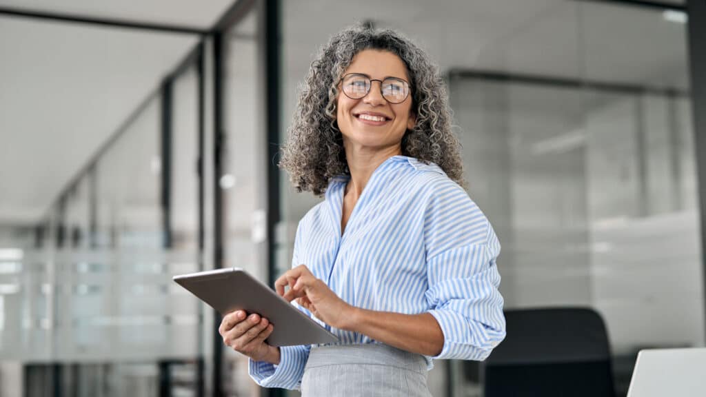 Woman holding tablet.