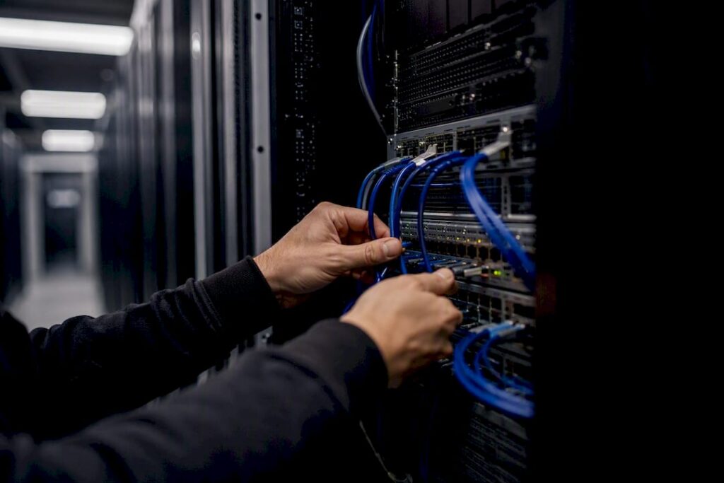 Hands connecting cables for financial data automation